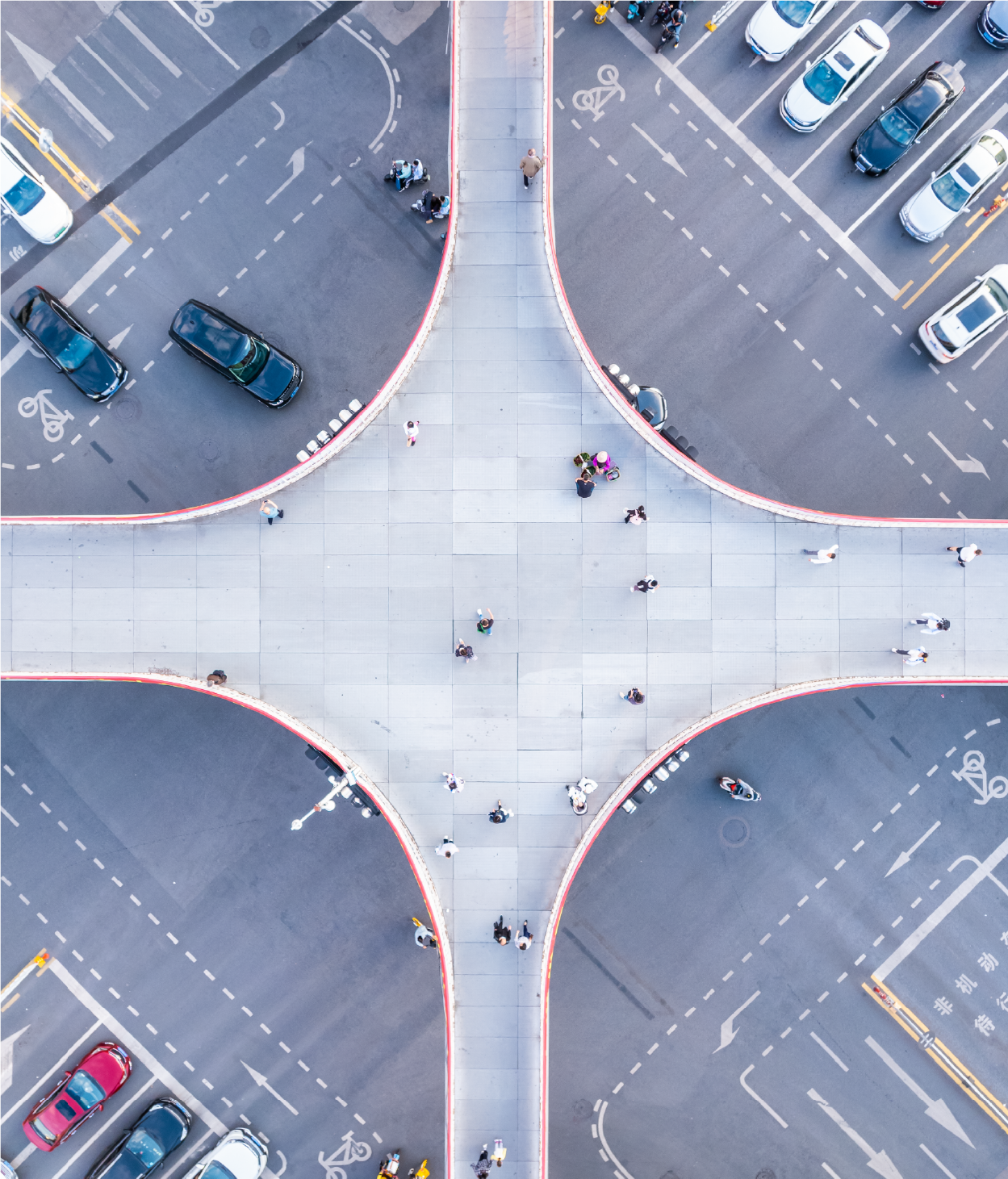 Aerial overhead photo of a raised crosswalk with people moving across it.